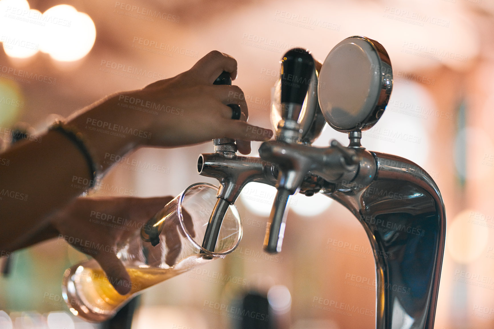 Buy stock photo Shot of an unrecognizable person pouring a beer from a tap inside of a beer brewery during the day