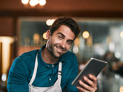 Buy stock photo Portrait of a cheerful young working man browsing on his cellphone inside of a beer brewery during the day