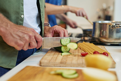 Buy stock photo Chopping, cooking and cucumber in kitchen, hands and healthy food for breakfast, morning and cutting board. House, counter and vegetables for nutrition, person and chef with recipe and ingredients