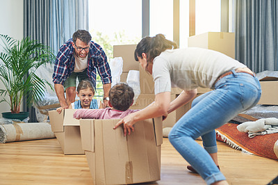 Buy stock photo Shot of a happy family having fun together on moving day