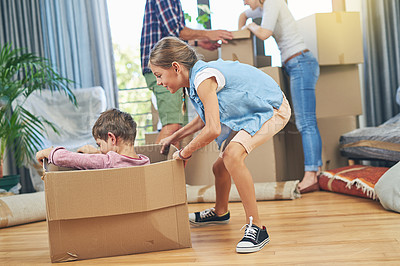 Buy stock photo Shot of a happy brother and sister having fun together on moving day