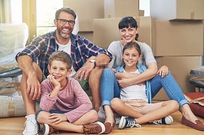 Buy stock photo Portrait of a happy family spending time together in their home on moving day