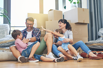 Buy stock photo Happy, family and moving with boxes in apartment on the floor are excited with the mortgage. Parents, children and new home for investment are playful with box in the living room of property. 