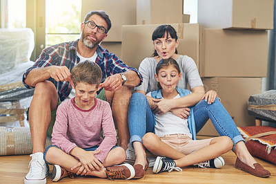 Buy stock photo Family, portrait and funny face in apartment with boxes as an investment for mortgage in real estate. Kids, parents and box with comic mood in new house with happiness are silly on the floor.