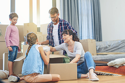 Buy stock photo Children, parents and boxes at new home for an investment for a lifestyle with happiness. Family, child and apartment moving box with smile in living room with love and being happy in modern house.