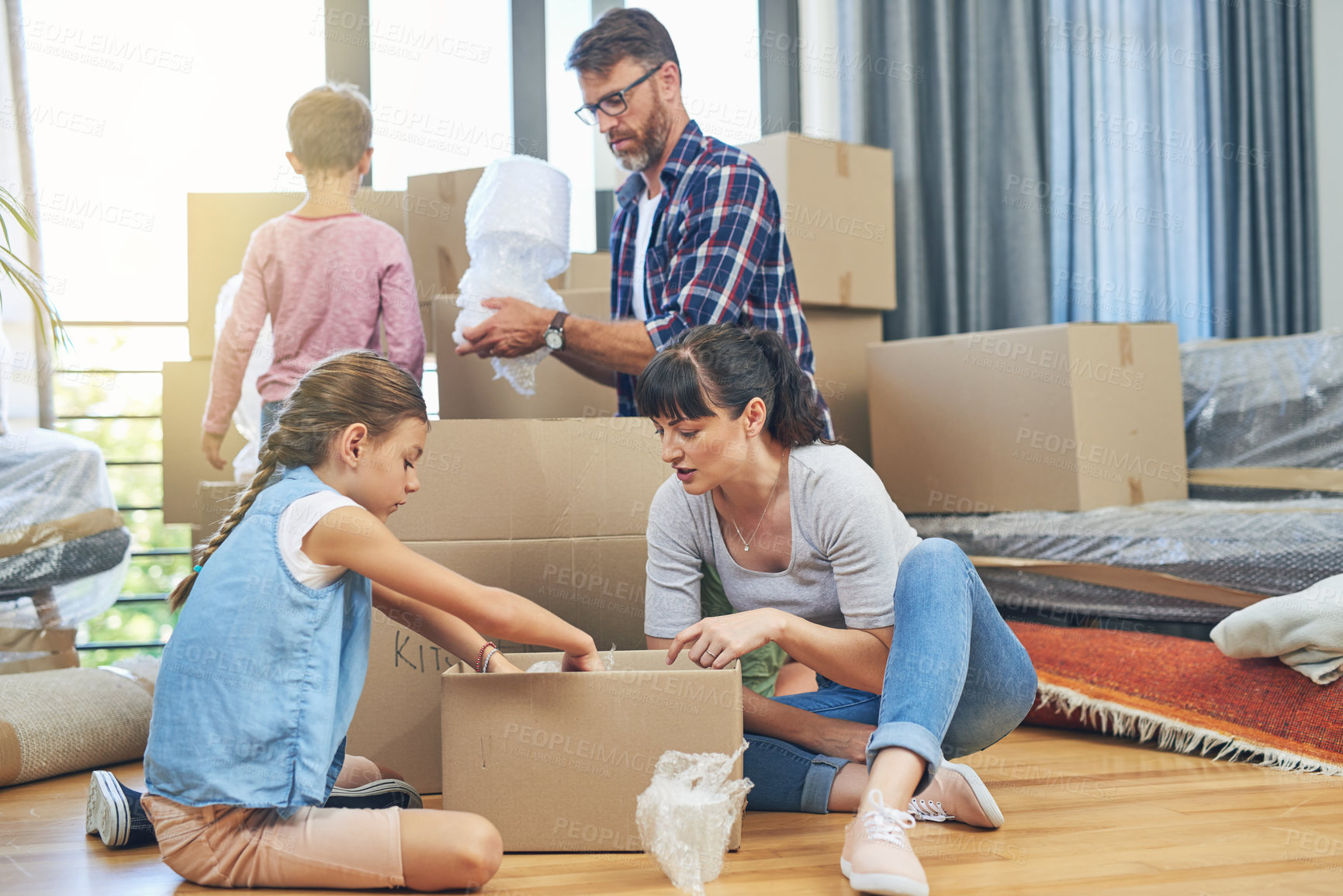 Buy stock photo Help, family and packing boxes for moving to home, property relocation or rent. Children, parents and cardboard package for real estate investment, new start or house renovation with people together