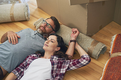 Buy stock photo Shot of a couple relaxing together in their home on moving day