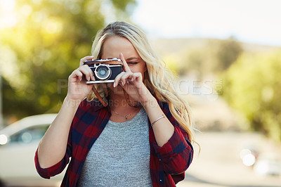 Buy stock photo Cropped shot of a young beautiful woman taking a photo in the city