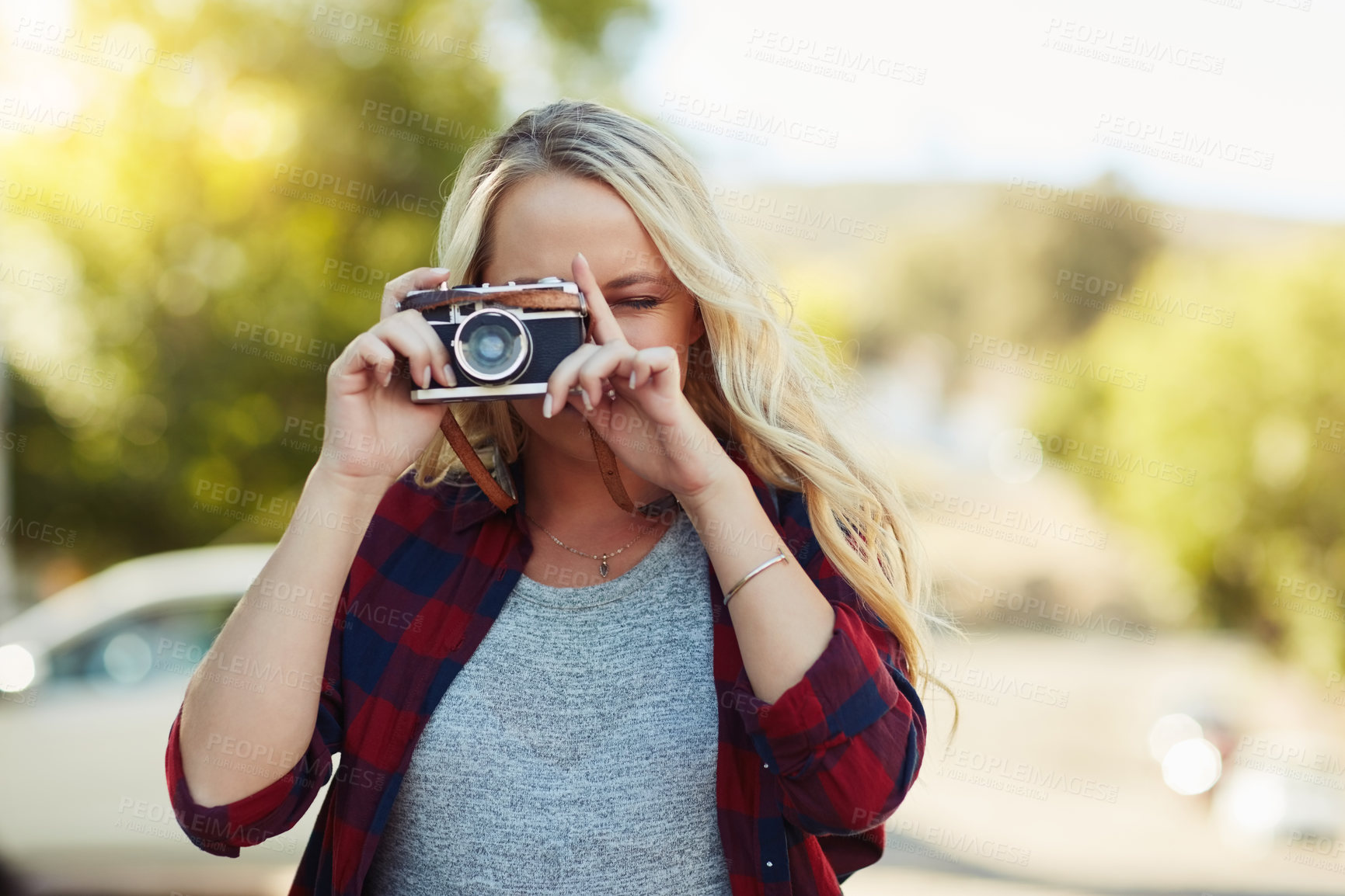 Buy stock photo Photographer, woman and camera outdoor for travel, vacation and memory. Photography, aim lens and girl take picture at park for holiday, tourism or content creator with vintage tech for social media