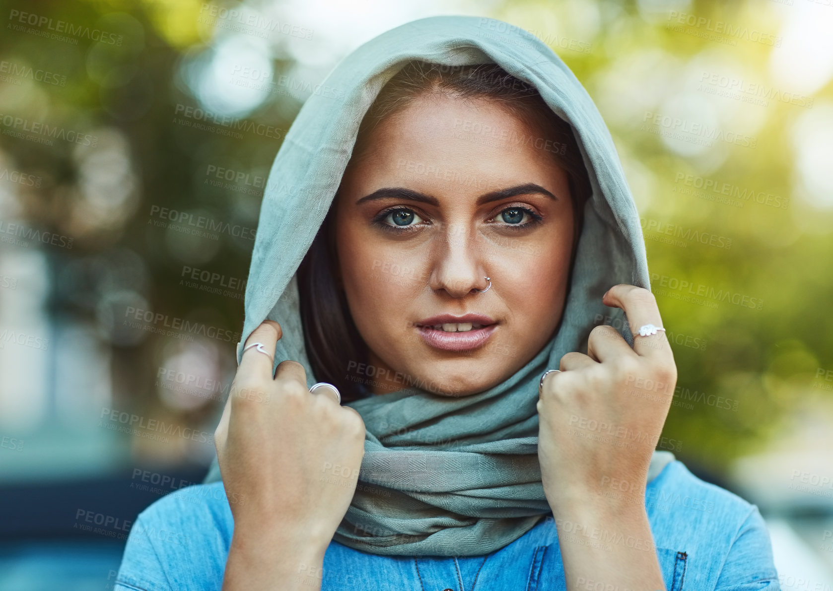 Buy stock photo Portrait of a young beautiful woman wearing a headscarf outside