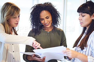 Buy stock photo Cropped shot of a group of businesswomen working in the office