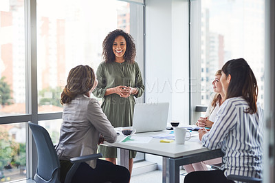 Buy stock photo Cropped shot of a group of businesswomen having a meeting in the office