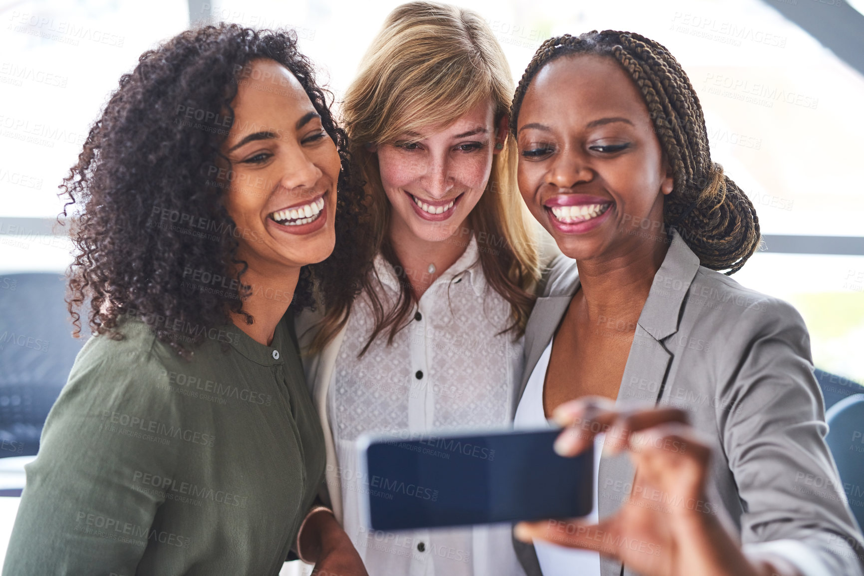 Buy stock photo Cropped shot of a group of  businesswomen taking a selfie in the office