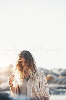 Buy stock photo Shot of an attractive young woman at the beach