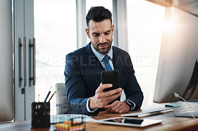 Buy stock photo Cropped shot of a handsome male executive working in a modern office