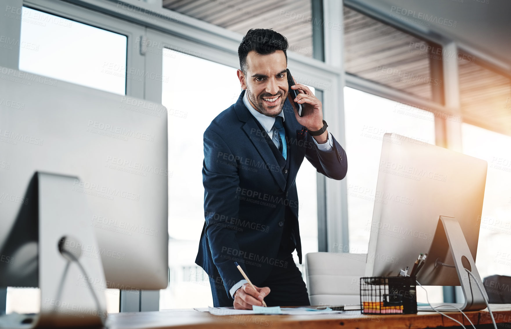 Buy stock photo Cropped shot of a handsome male executive working in a modern office