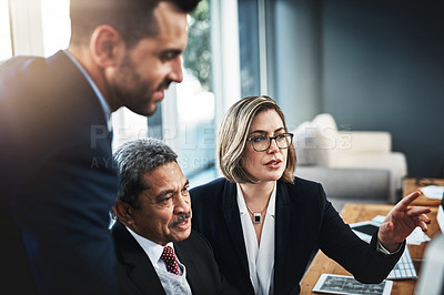 Buy stock photo Cropped shot of colleagues working together in a modern office
