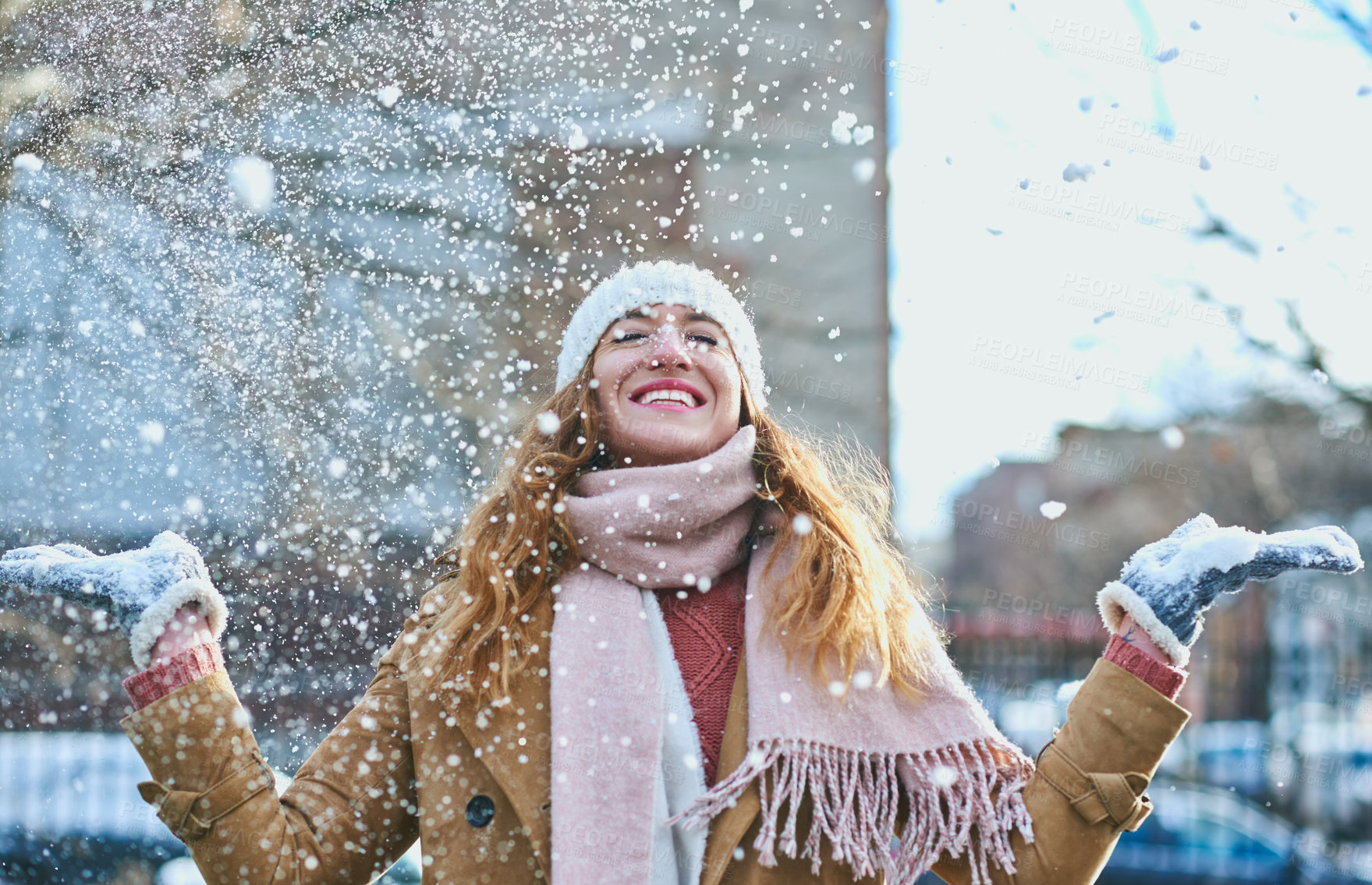 Buy stock photo Shot of an attractive young woman enjoying being out in the snow