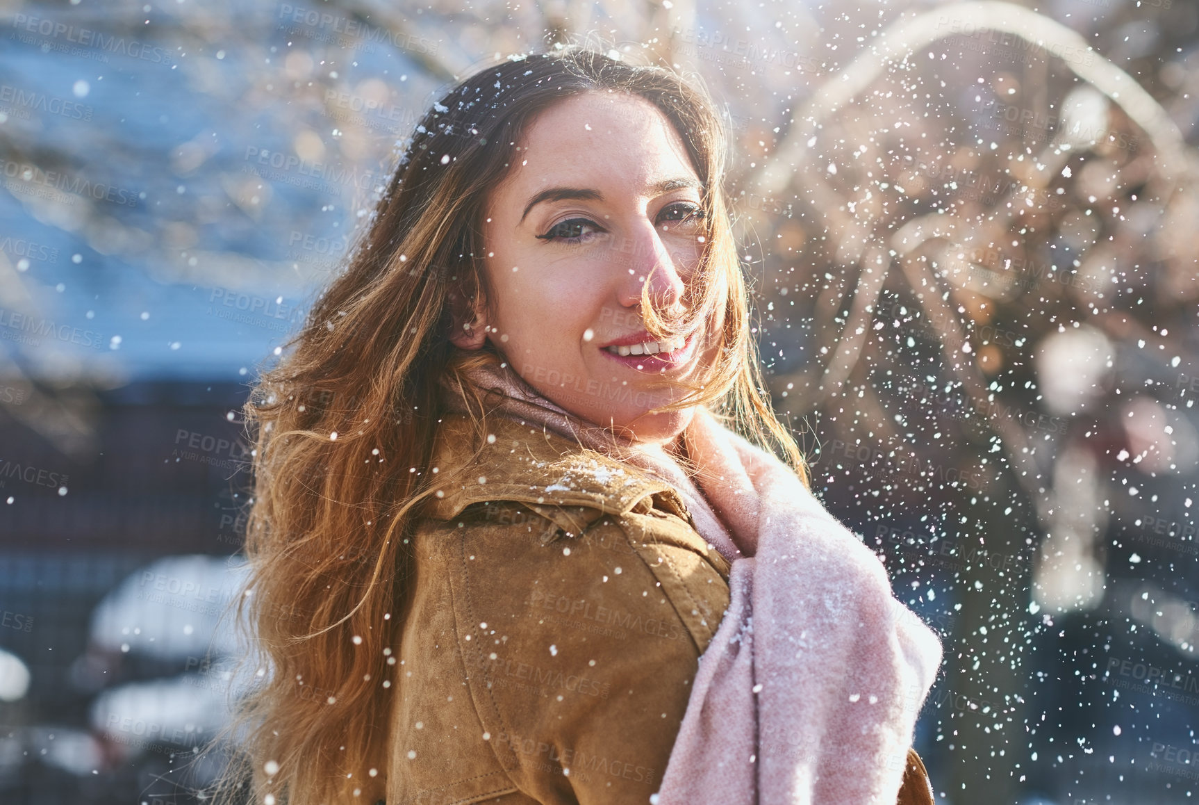 Buy stock photo Shot of an attractive young woman enjoying being out in the snow