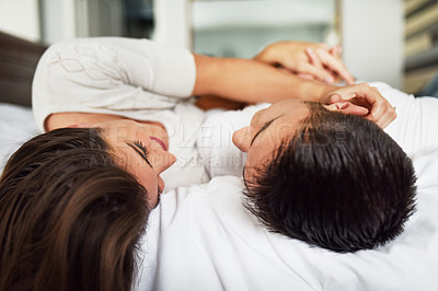 Buy stock photo Shot of young couple spending their day indoors