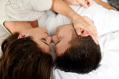 Buy stock photo Shot of young couple spending their day indoors