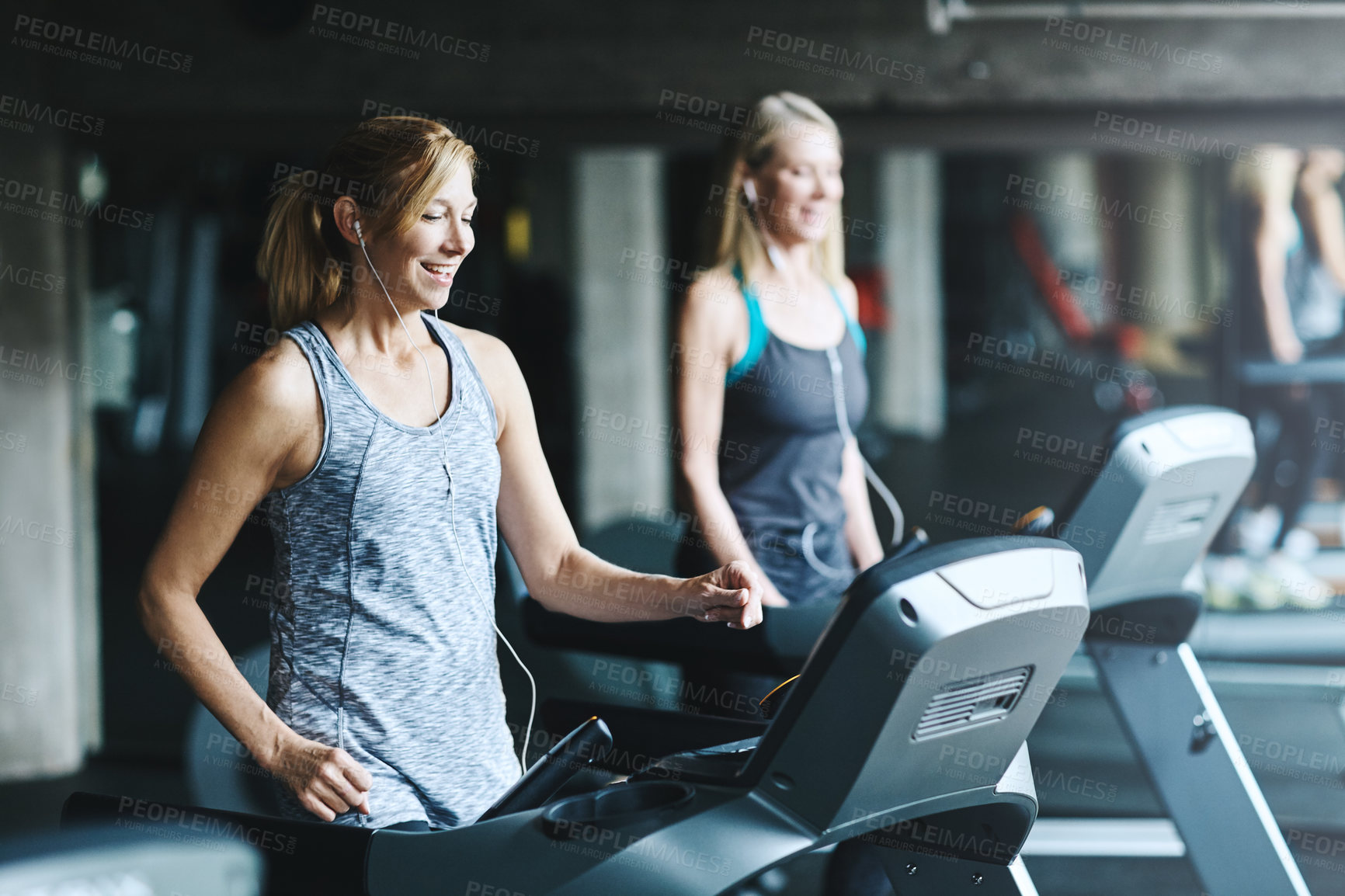 Buy stock photo Shot of mature women working out in the gym