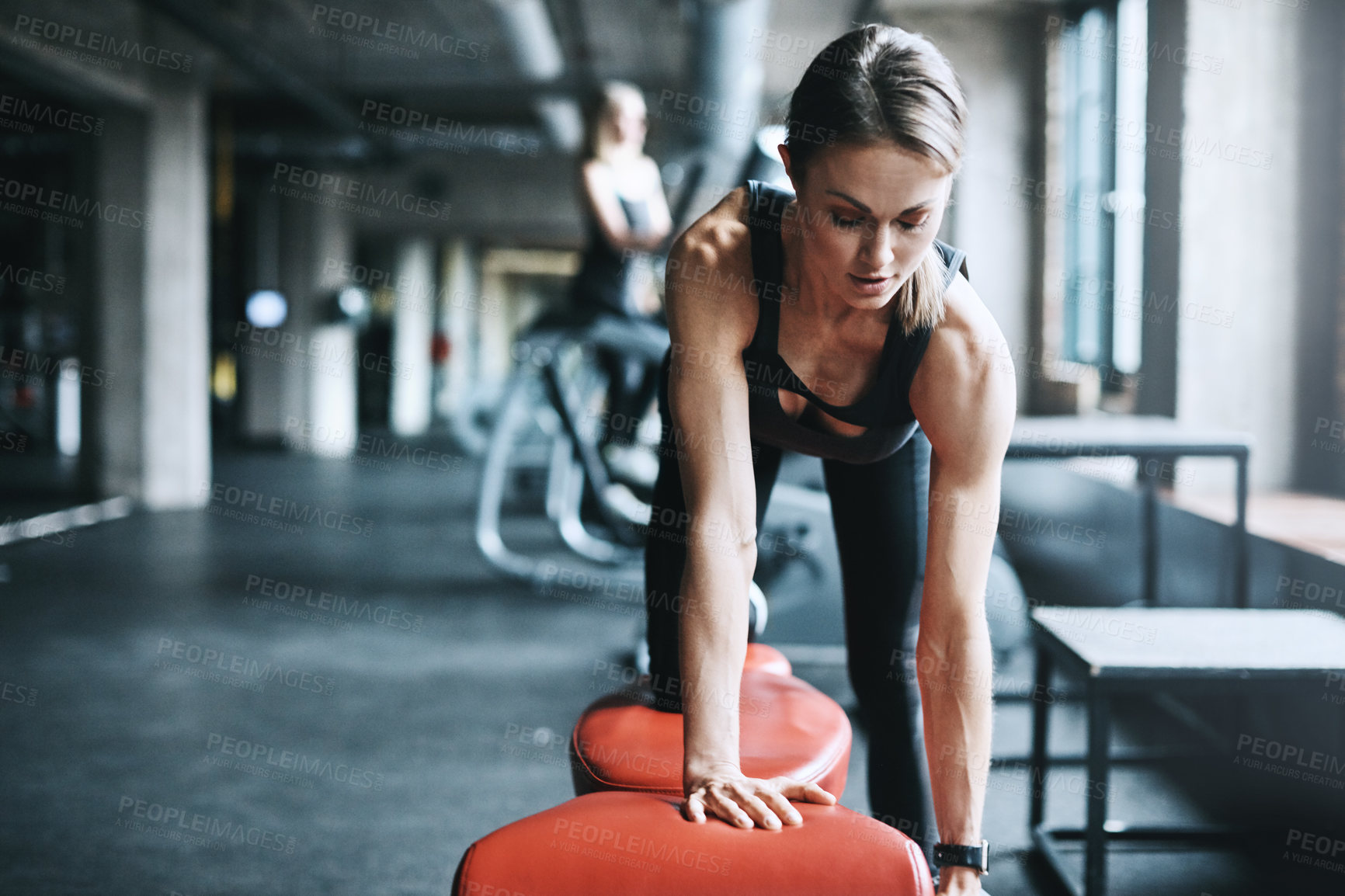 Buy stock photo Shot of an attractive woman working out in the gym