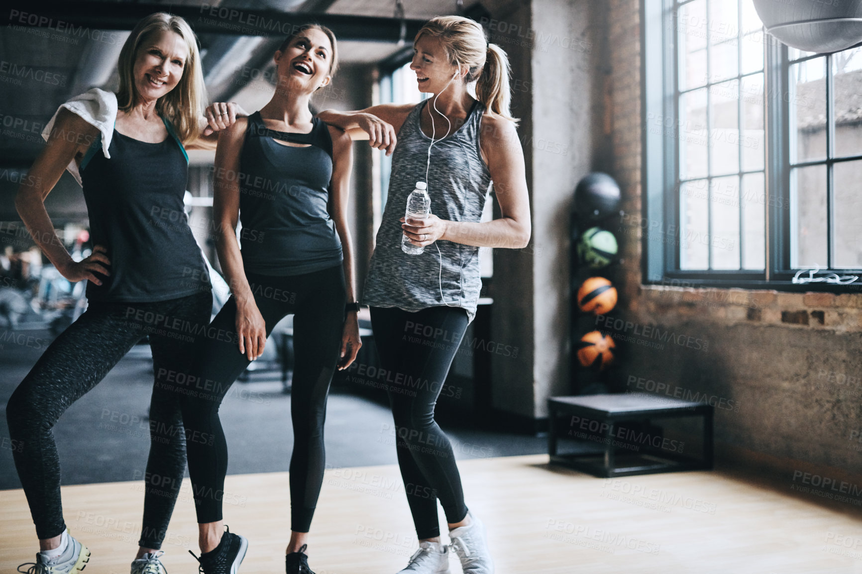 Buy stock photo Full length portrait of three attractive and athletic women working out in the gym