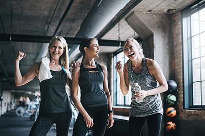 Buy stock photo Cropped portrait of three attractive and athletic women working out in the gym