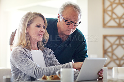 Buy stock photo Cropped shot of an affectionate senior married couple spending time together at home