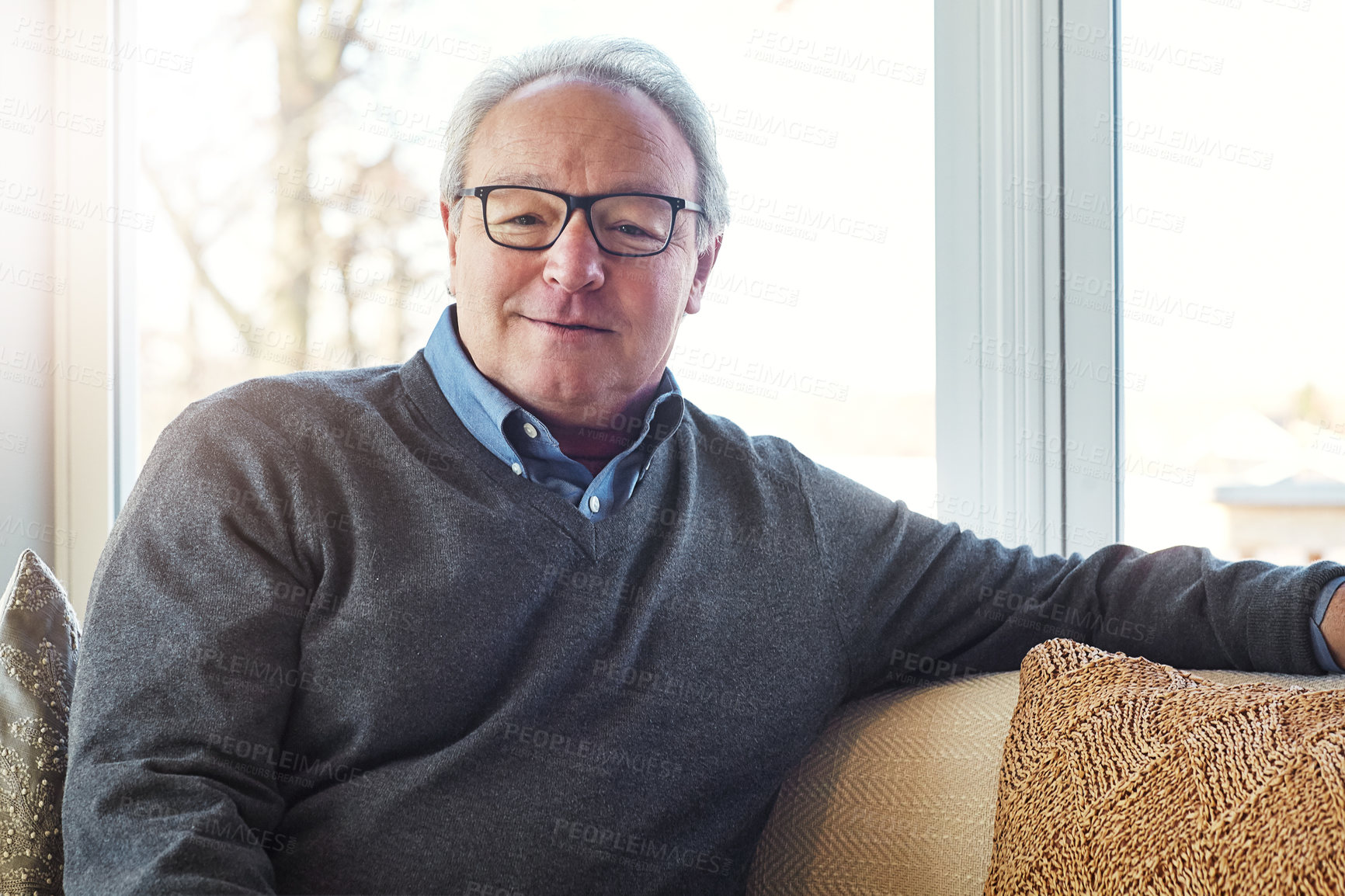 Buy stock photo Cropped shot of a senior man relaxing at home