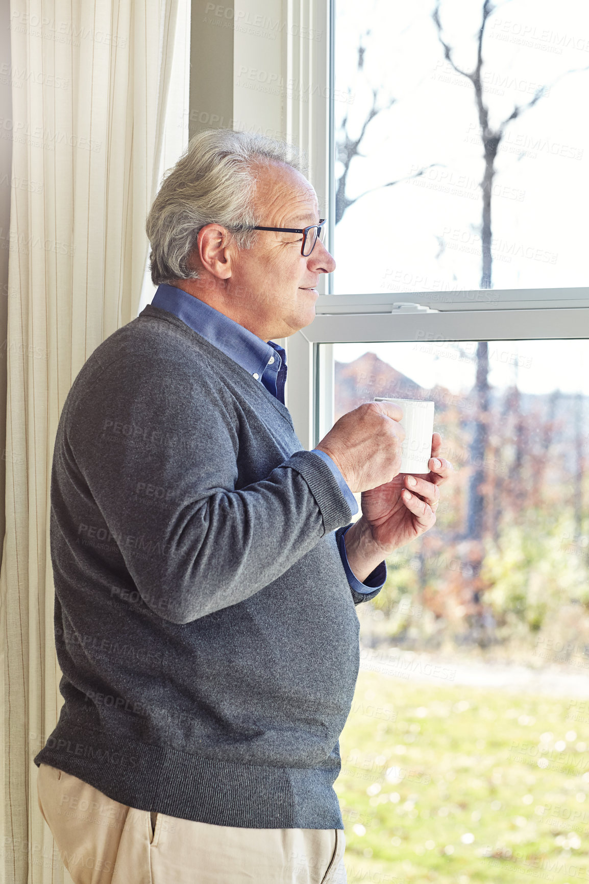 Buy stock photo Cropped shot of a senior man relaxing at home