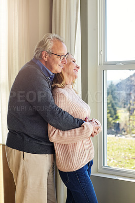 Buy stock photo Cropped shot of an affectionate senior married couple spending time together at home