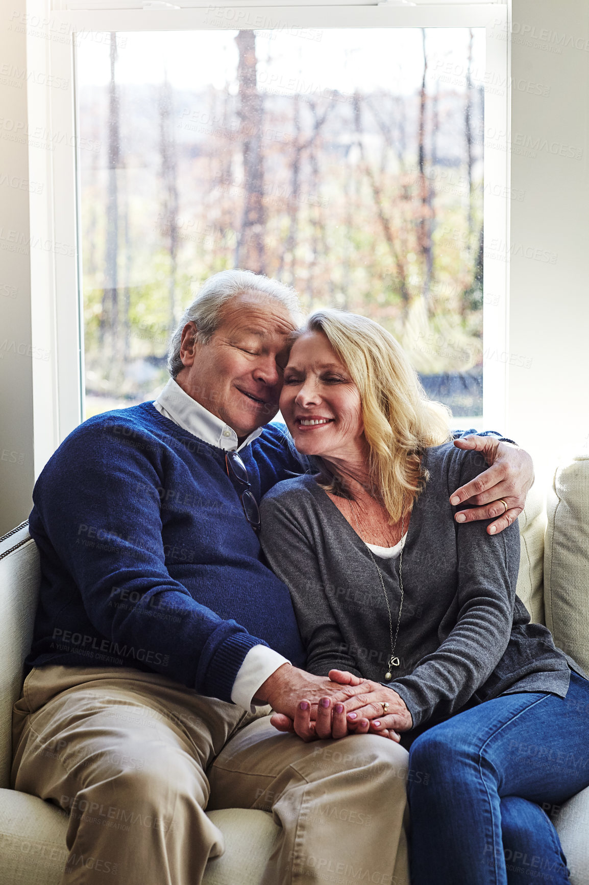 Buy stock photo Cropped shot of an affectionate senior married couple spending time together at home