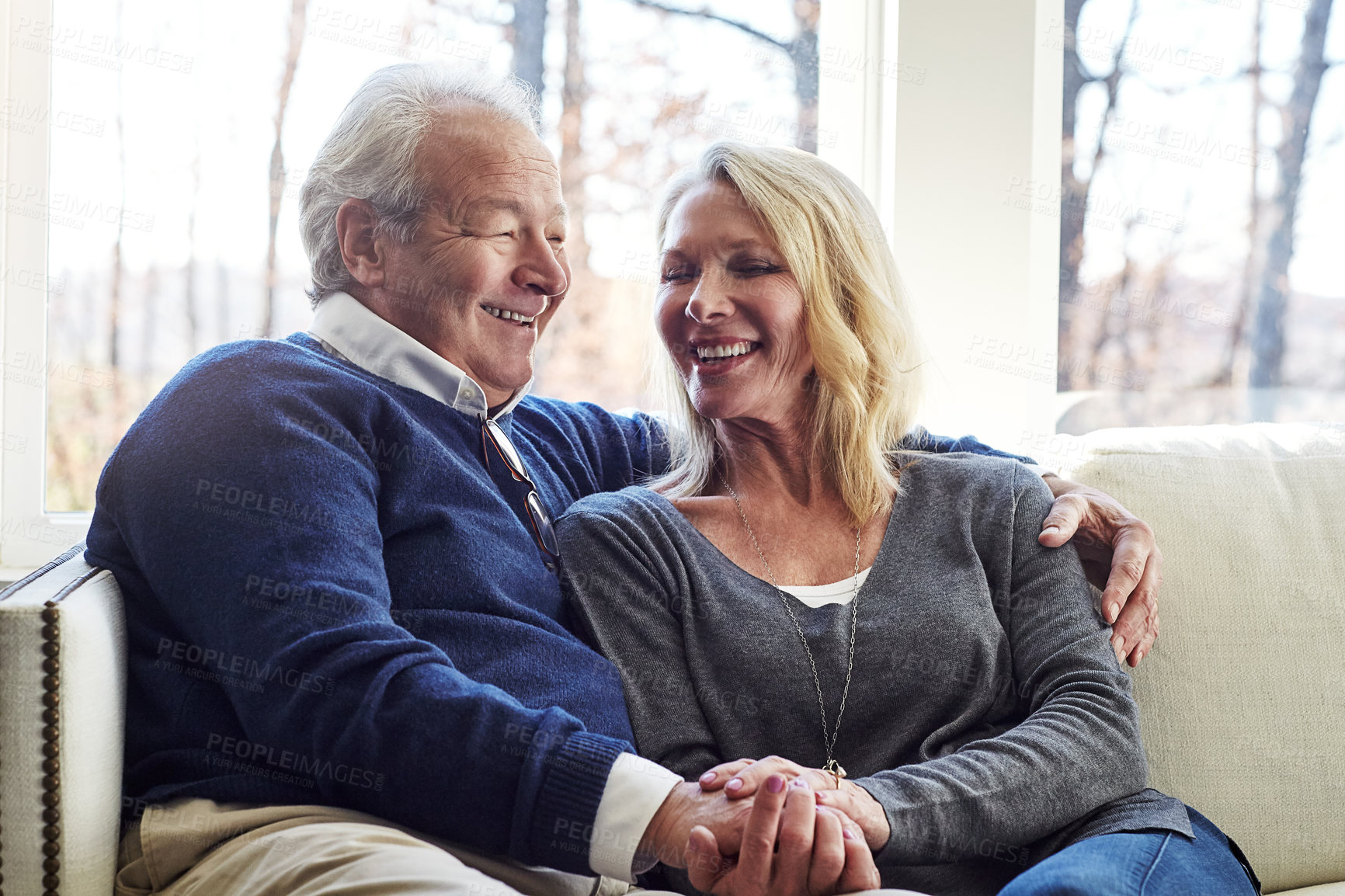 Buy stock photo Cropped shot of an affectionate senior married couple spending time together at home