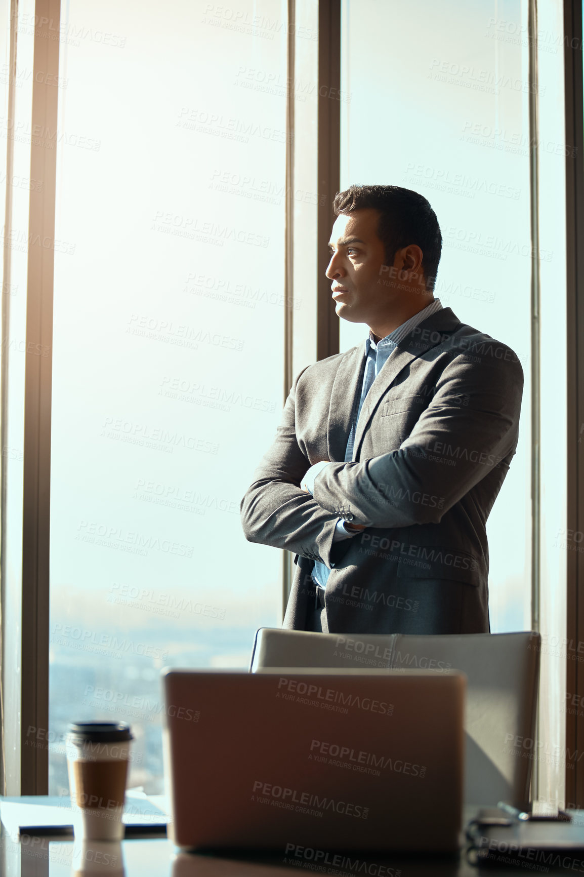 Buy stock photo Thinking, office window and serious man with business idea, plan or vision in high rise building. Professional, entrepreneur and male CEO with arms crossed for inspiration, dream and corporate goals