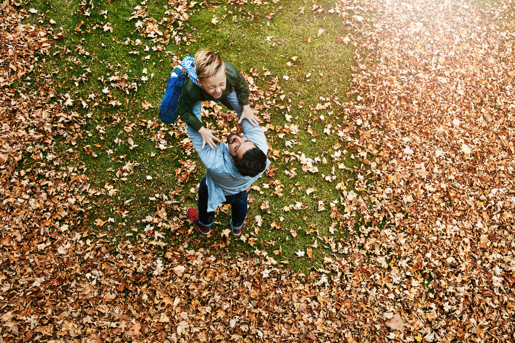 Buy stock photo Father, boy and above with lifting in park for fun with bonding, care and support in London. Relationship, parent and son with playing in smile at garden for love, trust and child development