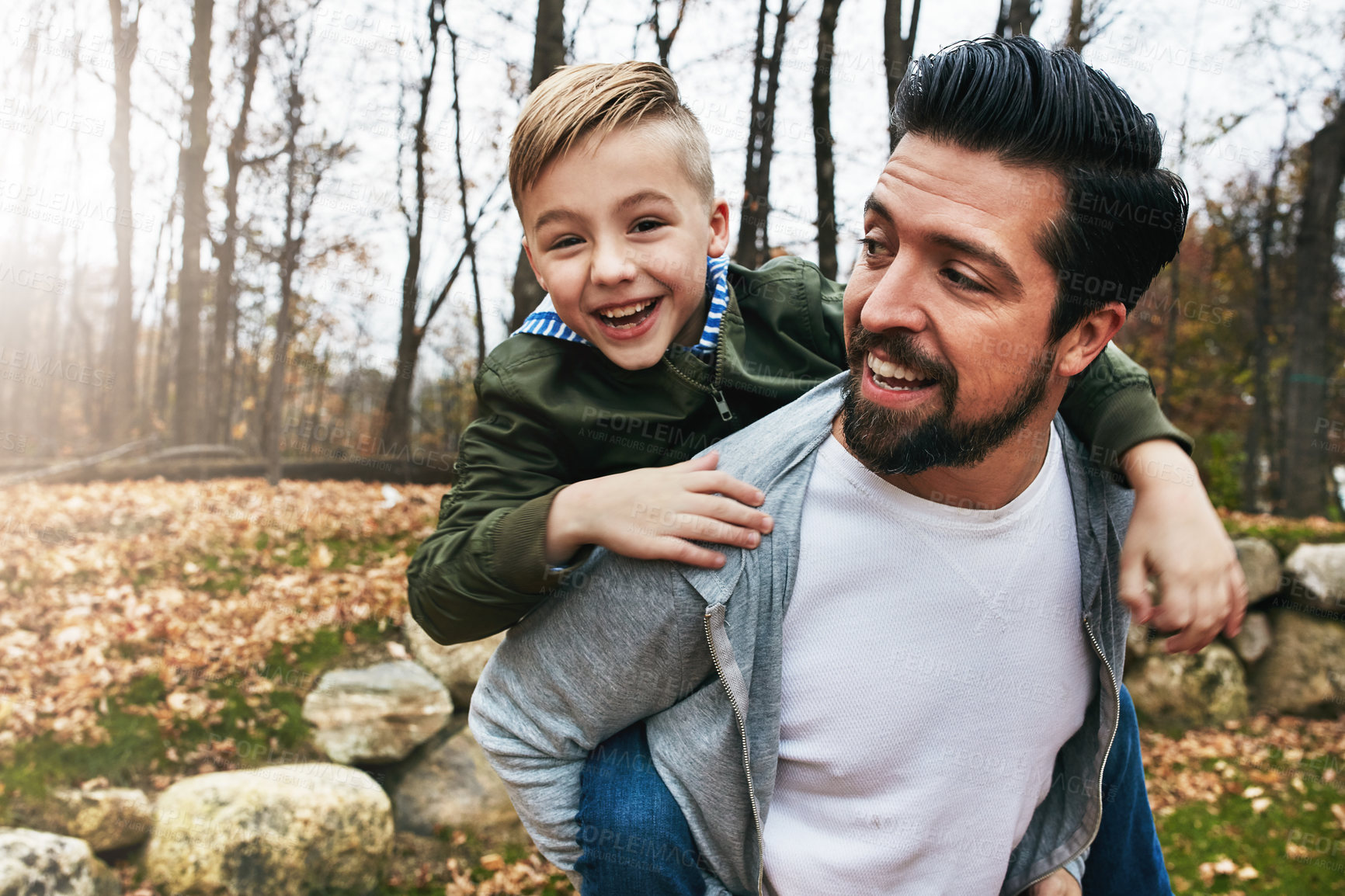 Buy stock photo Shot of a father and his little son  having fun outdoors