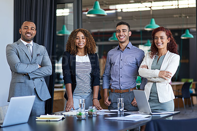 Buy stock photo Cropped portrait of a group of young businesspeople standing in the boardroom