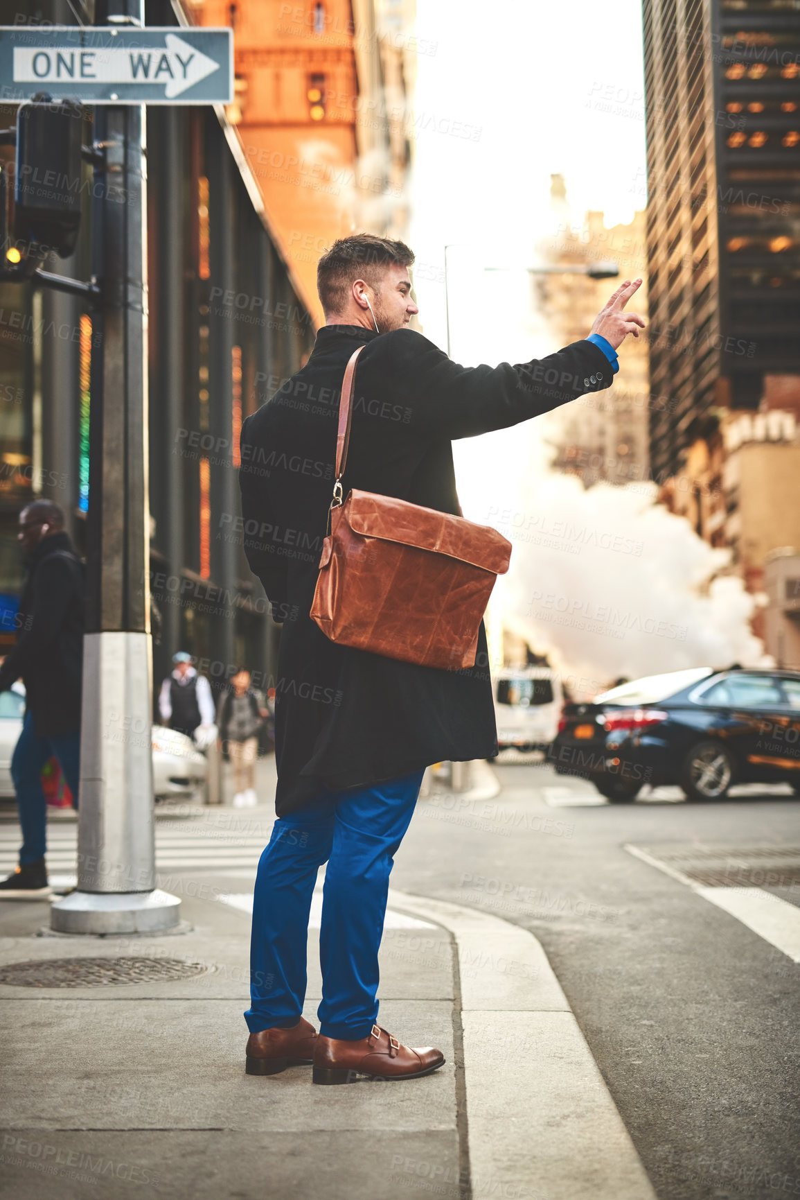 Buy stock photo Businessman, waving taxi and travel in city, street and earphones for listening to music. Male person, outdoor and journey to work in urban town, professional and signal cab with gesture on road