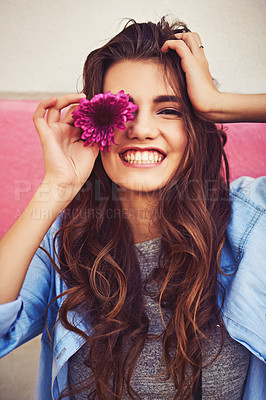 Buy stock photo Portrait of a beautiful young woman posing against a wall outside