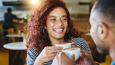 Buy stock photo Cropped shot of an attractive young woman spending time with her boyfriend in a coffee shop
