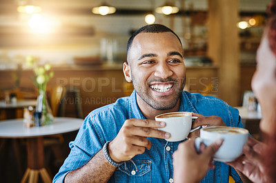 Buy stock photo Cropped shot of a handsome young man spending time with his girlfriend in a coffee shop