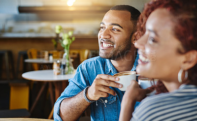 Buy stock photo Cropped shot of a handsome young man spending time with his girlfriend in a coffee shop