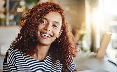 Buy stock photo Portrait of an attractive young woman sitting in a cafe