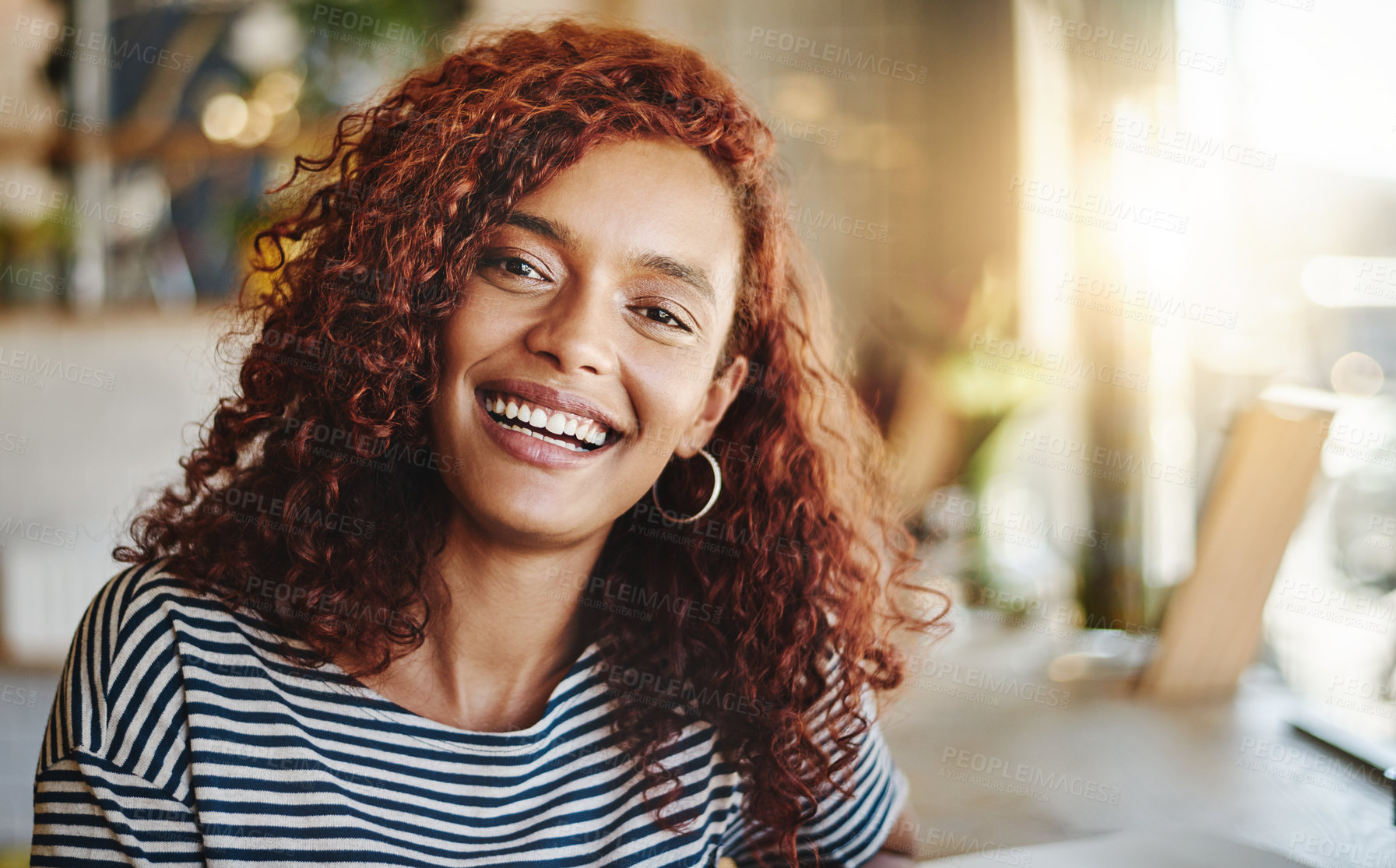 Buy stock photo Portrait of an attractive young woman sitting in a cafe