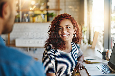 Buy stock photo Shot of two people having a discussion in a cafe