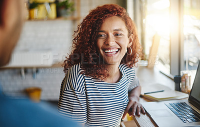 Buy stock photo Shot of two people having a discussion in a cafe