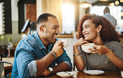 Buy stock photo Cropped shot of an affectionate young couple enjoying their date in the coffee shop