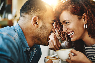 Buy stock photo Cropped shot of an affectionate young couple enjoying their date in the coffee shop